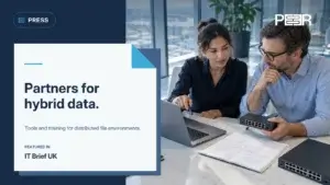 IT Brief UK: Partners for hybrid data. Tools and training for distributed file environments. Illustrative AI-generated scene.
